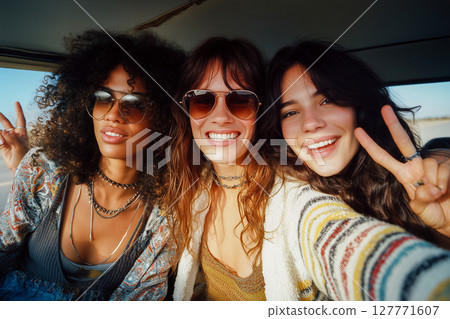 Three women are smiling and posing for a picture 127771607