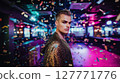 Stylish young man in glitter outfit standing in colorful nightclub with falling confetti. Nightlife celebration with dramatic lighting and bokeh background. LGBT pride, queer identity, and fashion 127771776