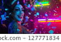 Smiling drag queen with glitter makeup celebrating under neon lights and falling confetti. Studio portrait in nightclub environment. Drag performance and LGBT pride concept. Design for poster, banner 127771834