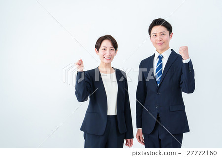 Business person who makes a guts pose 127772160