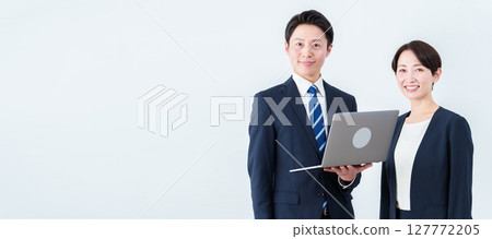 Business person with a computer Business person with a computer 127772205