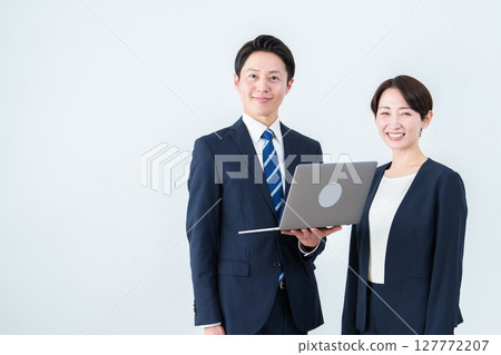 Business person with a computer Business person with a computer 127772207