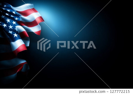 Waving American Flag in Dramatic Lighting with Dark Background and Soft Blue Glow 127772215