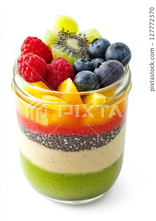 Vibrant dessert with colorful fruits and chia seeds arranged in a glass, perfect for a healthy treat 127772370