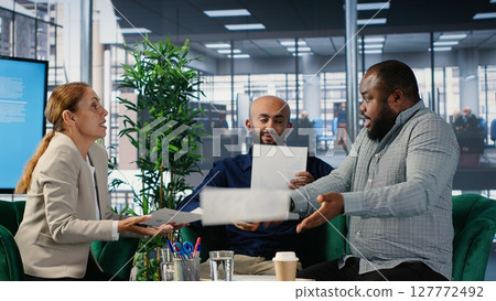 Corporate dispute involving powerful people during a briefing meeting, misunderstanding over strategic thinking. Disagreement due to frustration in a multicultural environment. Camera B. Corporate dispute involving powerful people during a briefing meeting, misunderstanding over strategic thinking. Disagreement due to frustration in a multicultural environment. Camera B. 127772492
