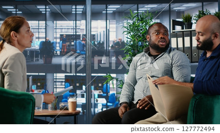Multiethnic professionals in a heated argument during corporate negotiation, addressing leadership dynamics and disagreements. Irritated business development within a diverse culture. Camera B. Multiethnic professionals in a heated argument during corporate negotiation, addressing leadership dynamics and disagreements. Irritated business development within a diverse culture. Camera B. 127772494
