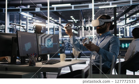 Admin using VR headset in data center to update server tech, configuring equipment using software tools. Server farm employee reviewing hardware analytics using virtual reality, camera A Admin using VR headset in data center to update server tech, configuring equipment using software tools. Server farm employee reviewing hardware analytics using virtual reality, camera A 127772533