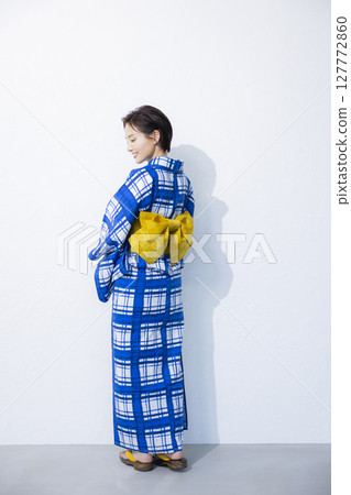 A woman in a yukata A woman in a yukata 127772860