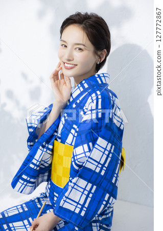 A woman in a yukata A woman in a yukata 127772867