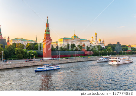 View of Kremlin with Vodovzvodnaya tower, Grand Kremlin Palace from repaired Bolshoy Kamenny Bridge in Moscow city on sunny summer day. Cruise ship sails on the Moscow river View of Kremlin with Vodovzvodnaya tower, Grand Kremlin Palace from repaired Bolshoy Kamenny Bridge in Moscow city on sunny summer day. Cruise ship sails on the Moscow river 127774888
