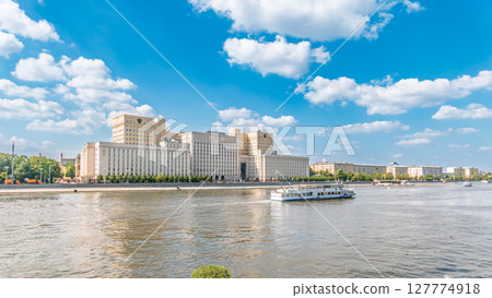 View of the Ministry of Defence of Russian Federation, and Moscow river embakment with cruise ships at sunset. View of the Ministry of Defence of Russian Federation, and Moscow river embakment with cruise ships at sunset. 127774918