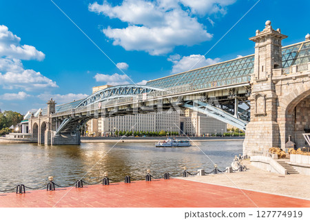 View of the Moscow river embankment, Pushkinsky bridge and cruise ships at sunset. 127774919
