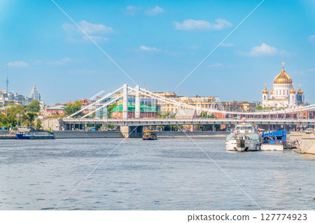 Cruise ship sails on the Moscow river in Moscow city center, popular place for walking. 127774923