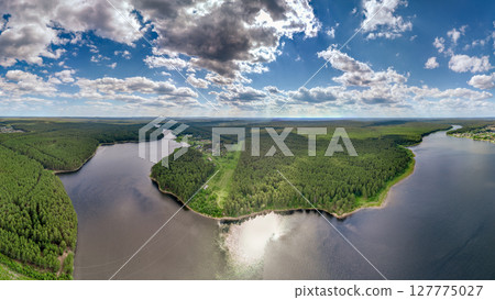 Big lake with green shores in bright sun light, aerial landscape. Recreation concept. Aerial view Big lake with green shores in bright sun light, aerial landscape. Recreation concept. Aerial view 127775027