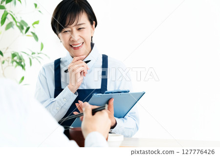 Middle-aged women checking their nutritional balance 127776426