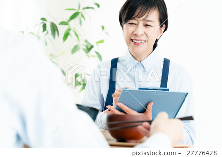 Middle-aged women checking their nutritional balance 127776428