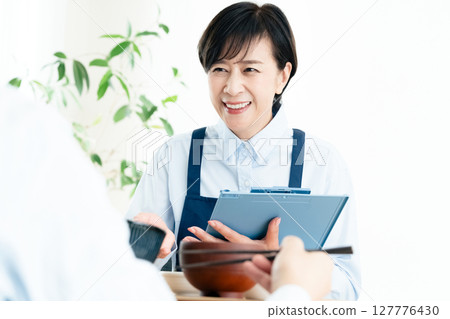 Middle-aged women checking their nutritional balance 127776430