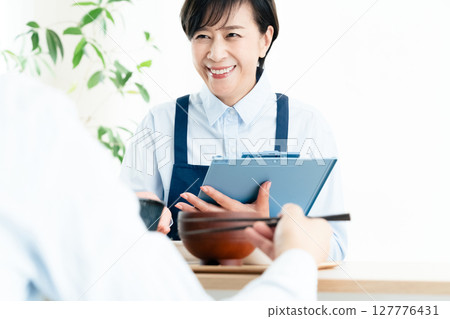 Middle-aged women checking their nutritional balance 127776431
