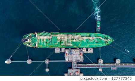 Aerial view lpg tanker ship vessel loading and unloading in oil terminal refinery, Global business import export logistic transport sea freight cargo lpg tanker ship, LPG tanker ship at port, Aerial view lpg tanker ship vessel loading and unloading in oil terminal refinery, Global business import export logistic transport sea freight cargo lpg tanker ship, LPG tanker ship at port, 127777843
