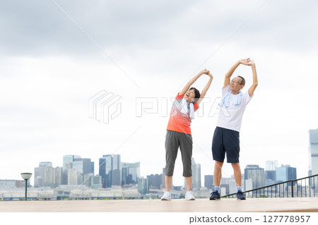 Senior men and women exercising Senior men and women exercising 127778957