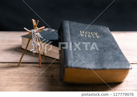 Religious belief concept Close up prayer Christian church service Bible Holy cross Spiritual power Blurred background Desk copy space Heaven God Catholic faith Praise book Jesus worship Gospel symbols 127779076
