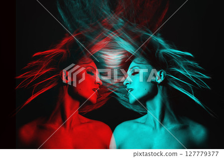 Beautiful woman with flying hair studio portrait in RGB color split effect style 127779377