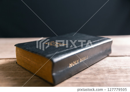 Religious belief concept Close up prayer Christian church service Bible Holy cross Spiritual power Blurred background Desk copy space Heaven God Catholic faith Praise book Jesus worship Gospel symbols Religious belief concept Close up prayer Christian church service Bible Holy cross Spiritual power Blurred background Desk copy space Heaven God Catholic faith Praise book Jesus worship Gospel symbols 127779505