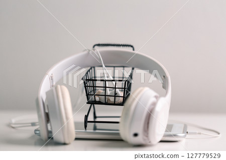 New technology modern Close up high resolution Wireless Earphones white Earbuds headphones black blur background Trendy minimal music device laptop concept phone accessories Comfortable Wooden table New technology modern Close up high resolution Wireless Earphones white Earbuds headphones black blur background Trendy minimal music device laptop concept phone accessories Comfortable Wooden table 127779529