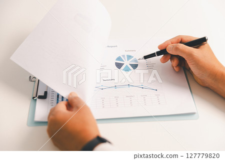 Business graph, chart on table. Financial development, banking account, statistic. Close up business people meeting to discuss situation on market. calculating investment. Business financial concept. Business graph, chart on table. Financial development, banking account, statistic. Close up business people meeting to discuss situation on market. calculating investment. Business financial concept. 127779820