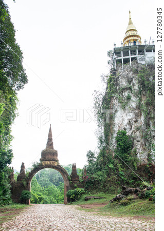 Temple gate at Dharma Khao Na Nai Luang Park Surat Thani, Thailand. 127780345