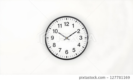 A simple, modern wall clock with a black frame against a white background. A simple, modern wall clock with a black frame against a white background. 127781169