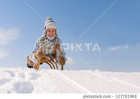 Children sled down the hill 127781968