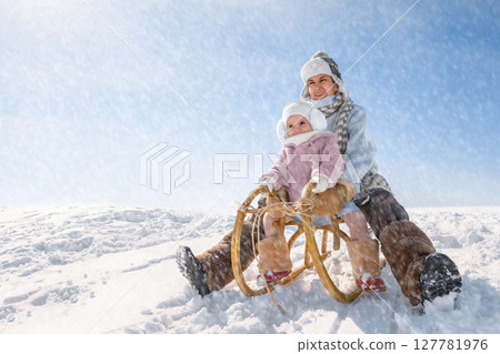 Children sled down the hill Children sled down the hill 127781976