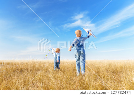 Little boys running in the open air. Little boys running in the open air. 127782474