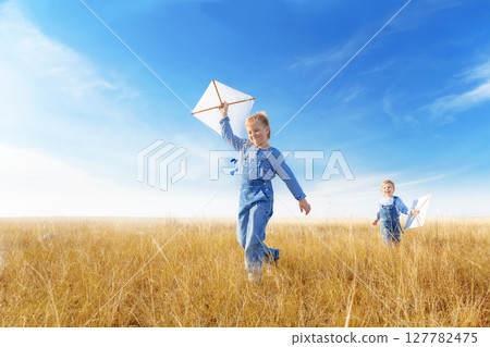Little boys running in the open air. Little boys running in the open air. 127782475