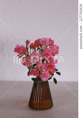 Mini roses in a vase Mini roses in a vase 127782626