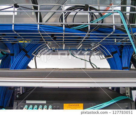 Copper cable infrastructure mounted on the metal wired trays 127783051