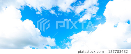 A simple landscape of blue sky and clouds 127783482