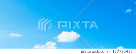 A simple landscape of blue sky and clouds 127783483