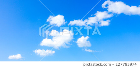 A simple landscape of blue sky and white clouds A simple landscape of blue sky and white clouds 127783974