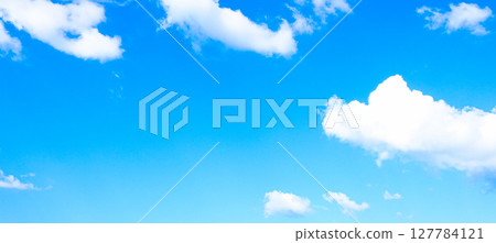 A simple landscape of blue sky and white clouds 127784121