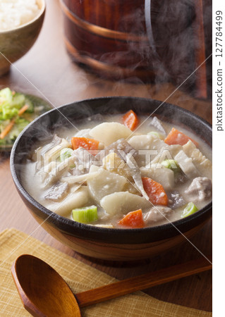 Pork and root vegetable soup 127784499