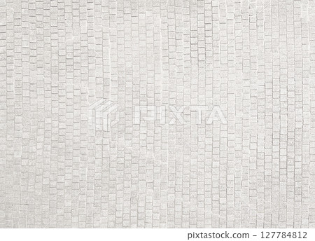 Background image of a light grey old cobblestone road surface Background image of a light grey old cobblestone road surface 127784812