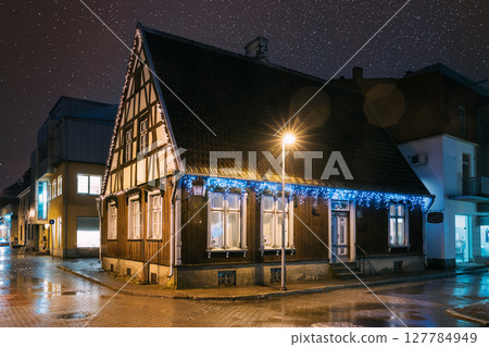 Parnu, Estonia. Night View Of Old Wooden Parnu Citizen s House At Nikolai Street In Evening Night Illuminations night starry stars sky. Parnu, Estonia. Night View Of Old Wooden Parnu Citizen s House At Nikolai Street In Evening Night Illuminations night starry stars sky. 127784949