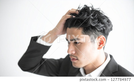 Male businessman with strange hair 127784977