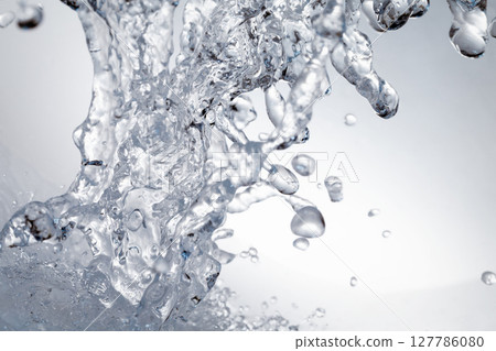Water splashes on a gray background. Water splashes on a gray background. 127786080