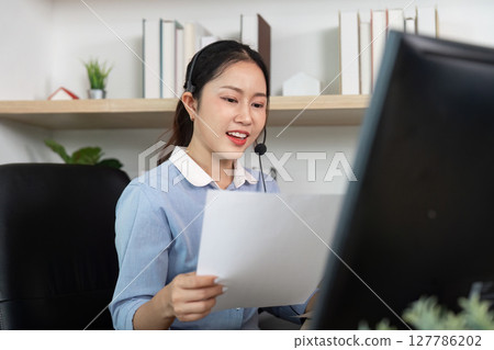 Call Center Professional Engaging with Clients at Home Office Call Center Professional Engaging with Clients at Home Office 127786202
