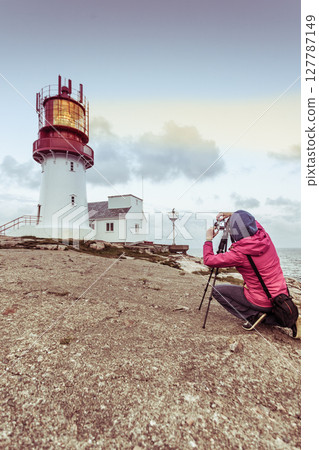 Tourist at Lindesnes Lighthouse in Norway Tourist at Lindesnes Lighthouse in Norway 127787149