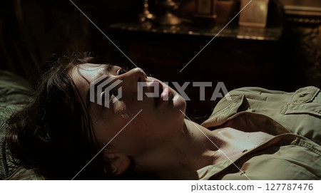 In eerie silence, the camera reveals a dim room where shadows dance, hiding a lurking danger. 127787476