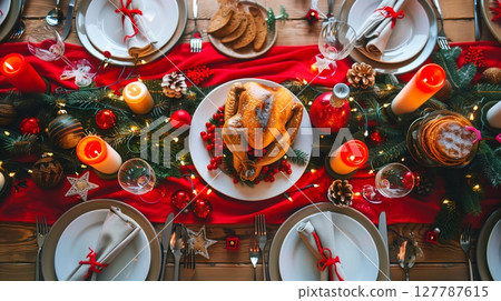 A festive Christmas dinner table invites warmth and joy for family and friends to celebrate together. 127787615